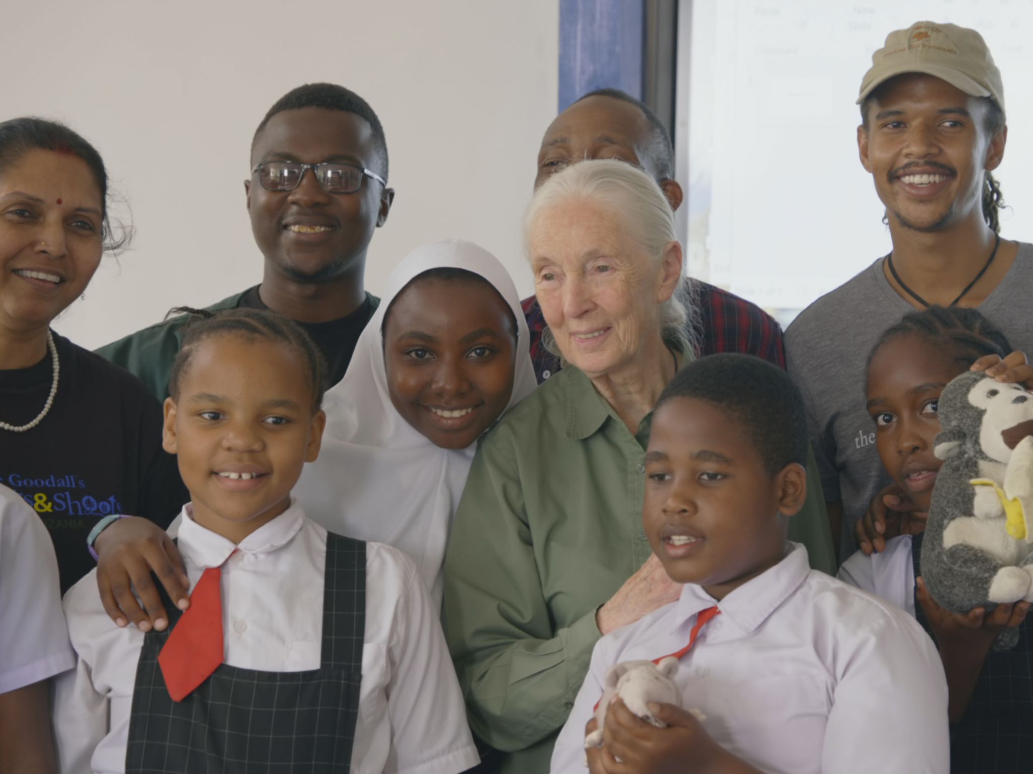 Dr. Jane Goodall and her grandson Merlin Van Lawick pose with students and volunteers of Roots &... [Photo of the day - April 2020]