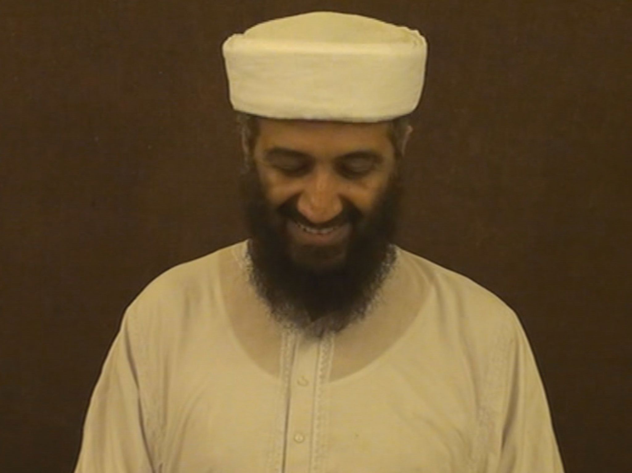 Osama bin Laden standing in front of camera during his speech. He messes up and smiles. This... [Photo of the day - December 2020]