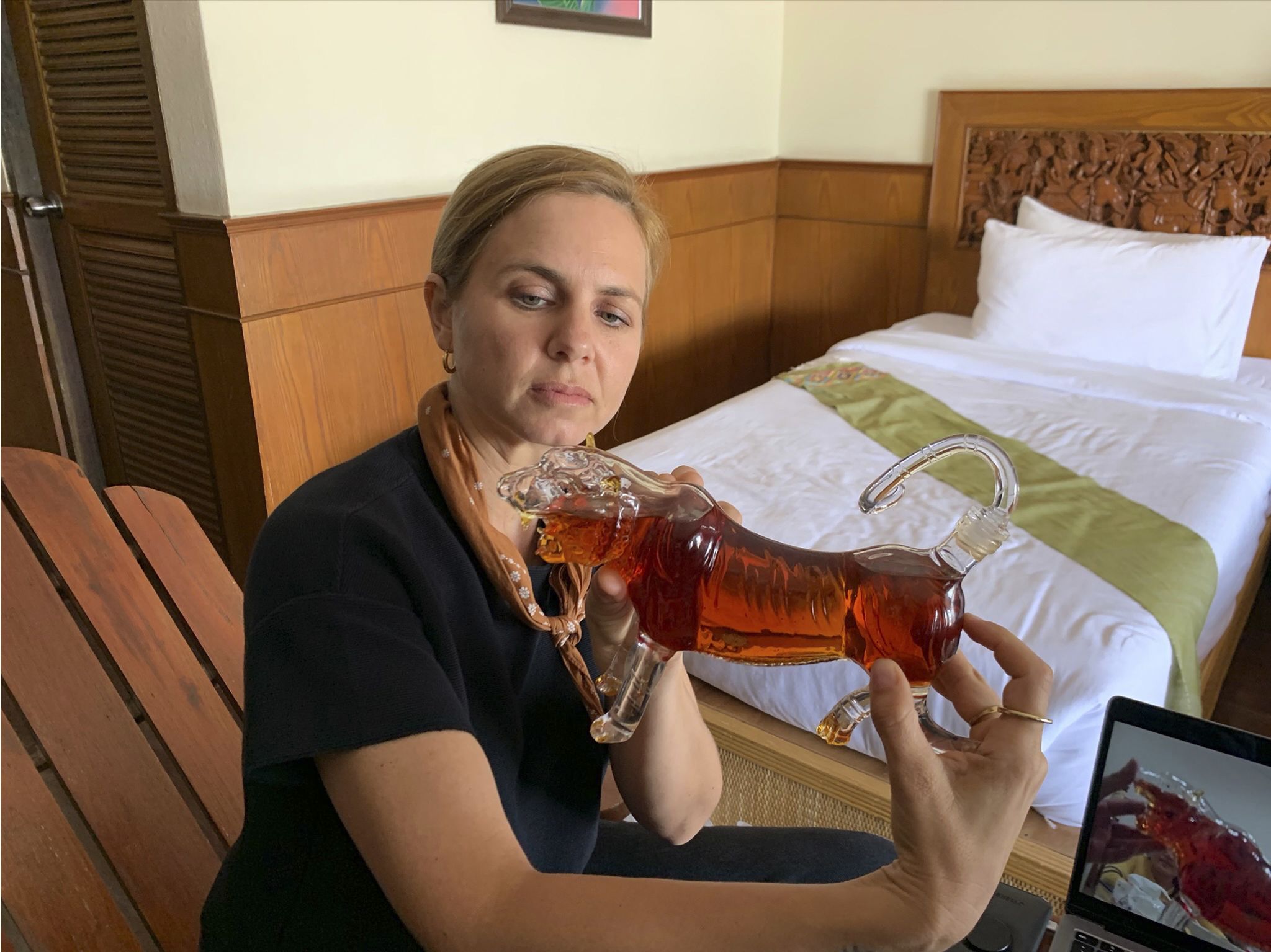 Mariana van Zeller examines a tiger-shaped bottle filled with what an undercover investigator... [Photo of the day - January 2021]