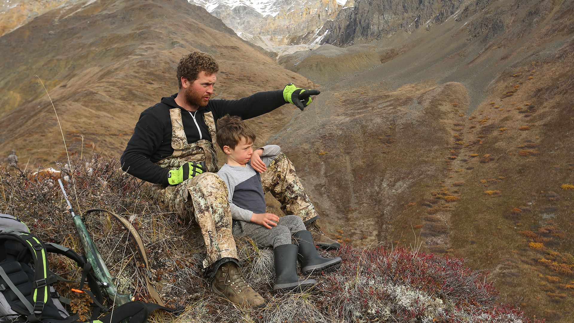 Kaleb Rowland shows his son Gilbert the view along the top of a mountain ridge near McCarthy,... [Photo of the day - January 2022]