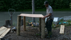 Jessie Holmes constructs a table to... [Photo of the day -  7 JULY 2022]