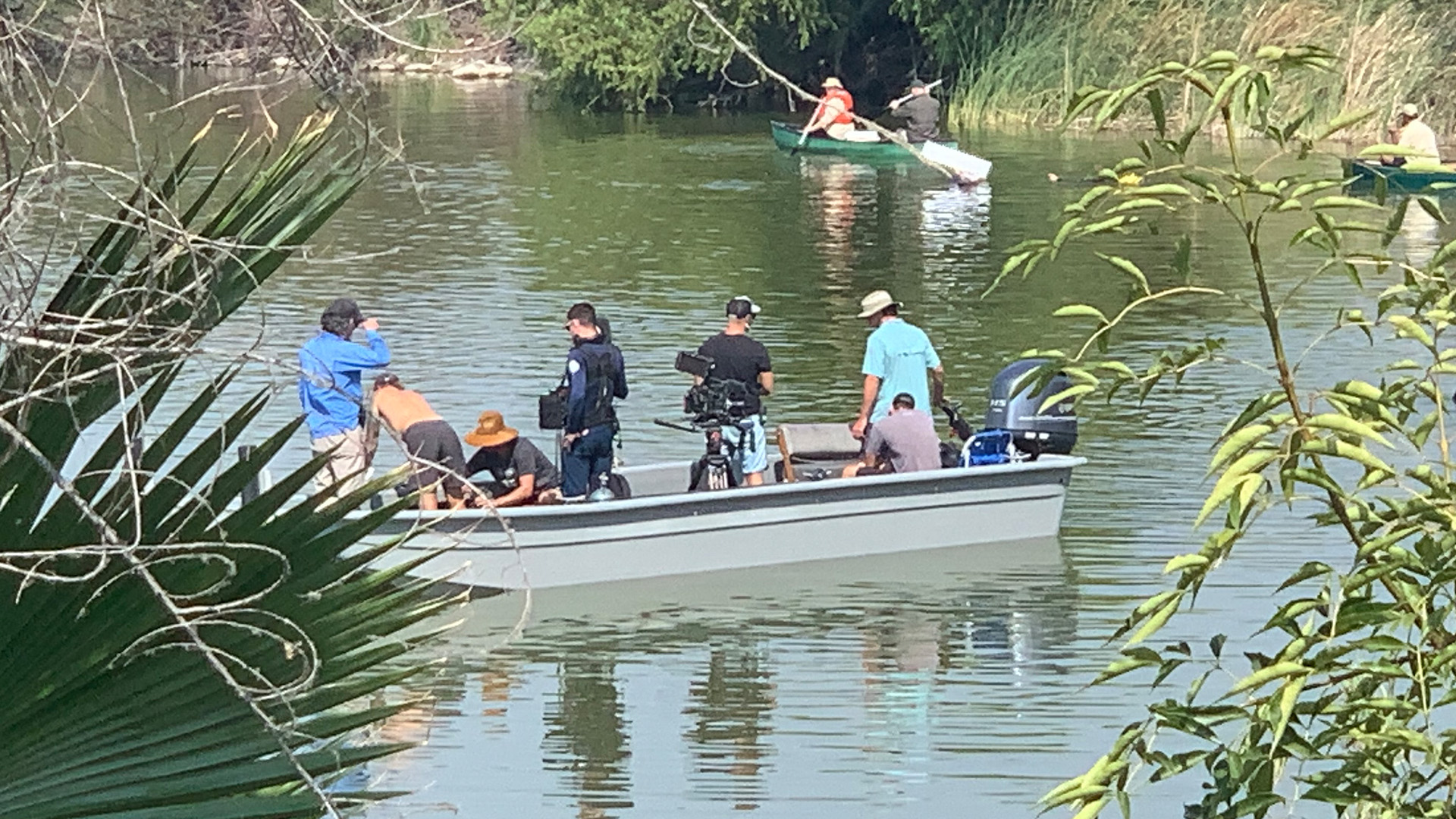 Camera crew prepares for the shoot as the talent canoes across the water. This is from Something... [Photo of the day - October 2022]