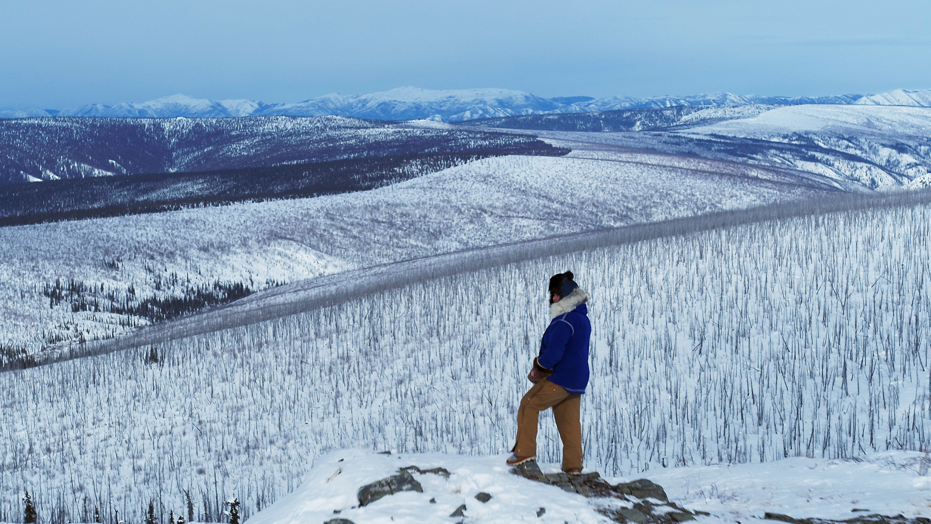Jody Potts-Joseph looking over the mountain ranges. This is from First Alaskans. [Photo of the day - January 2023]