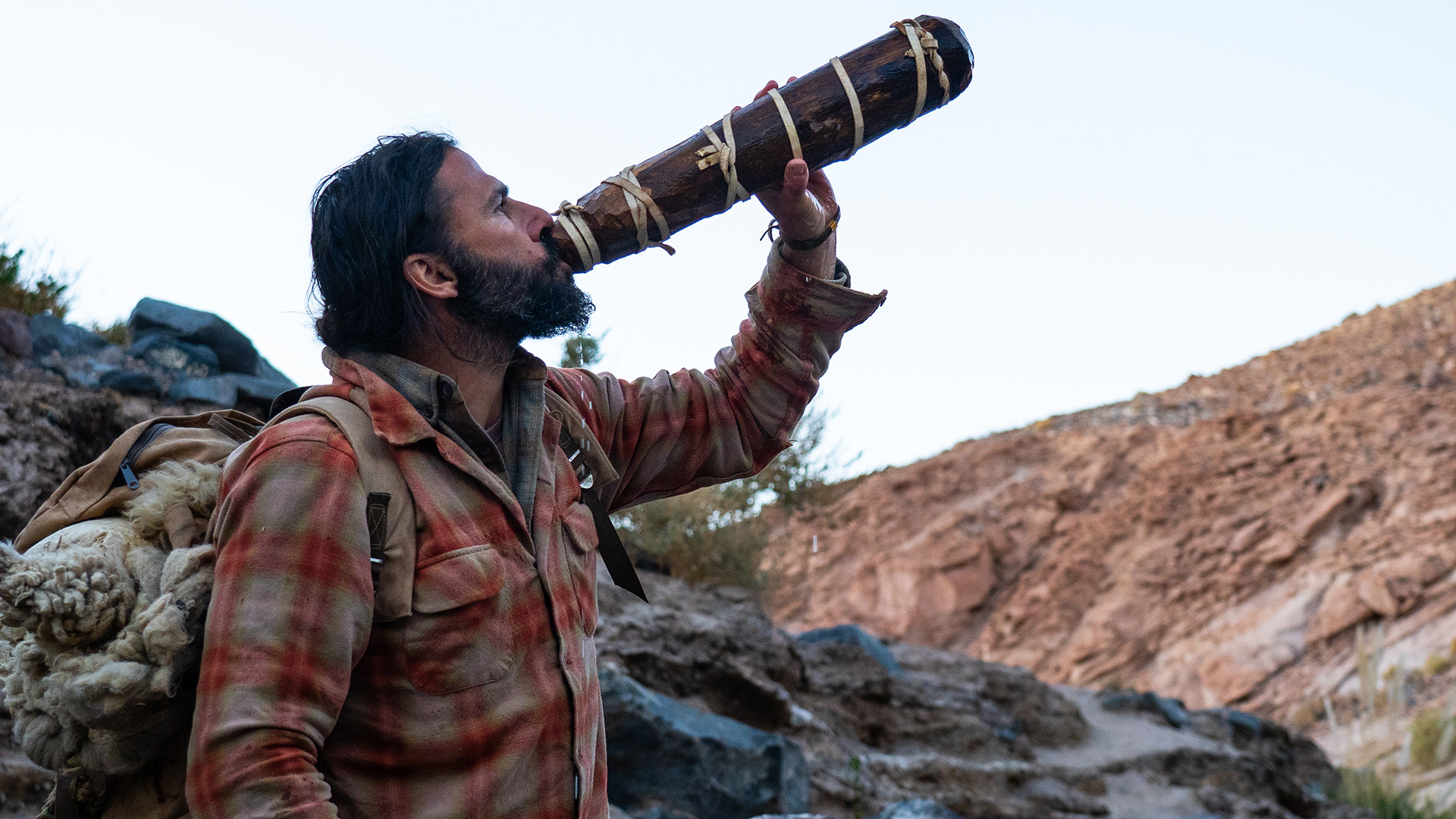 Hazen drinking from his hand-carved water bottle. This is from Primal Survivor: Over the Andes. [Photo of the day - February 2023]