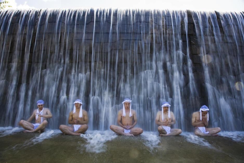 Men sit under a waterfall as part of training to become a Yamabushi, Mt. Haguru, Yamagata... [Photo of the day - September 2011]