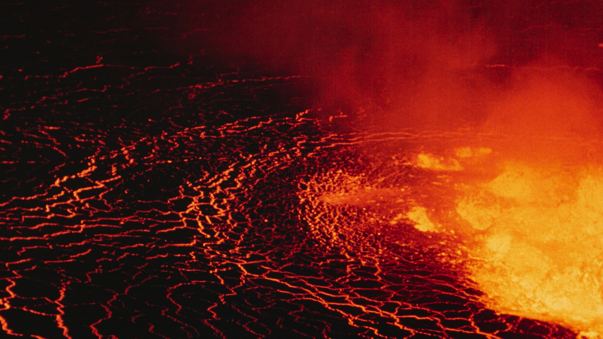 Bright gold and organge lava boils and bubbles from the depths of the Nyiragongo crater; 1973.... [Photo of the day - March 2023]