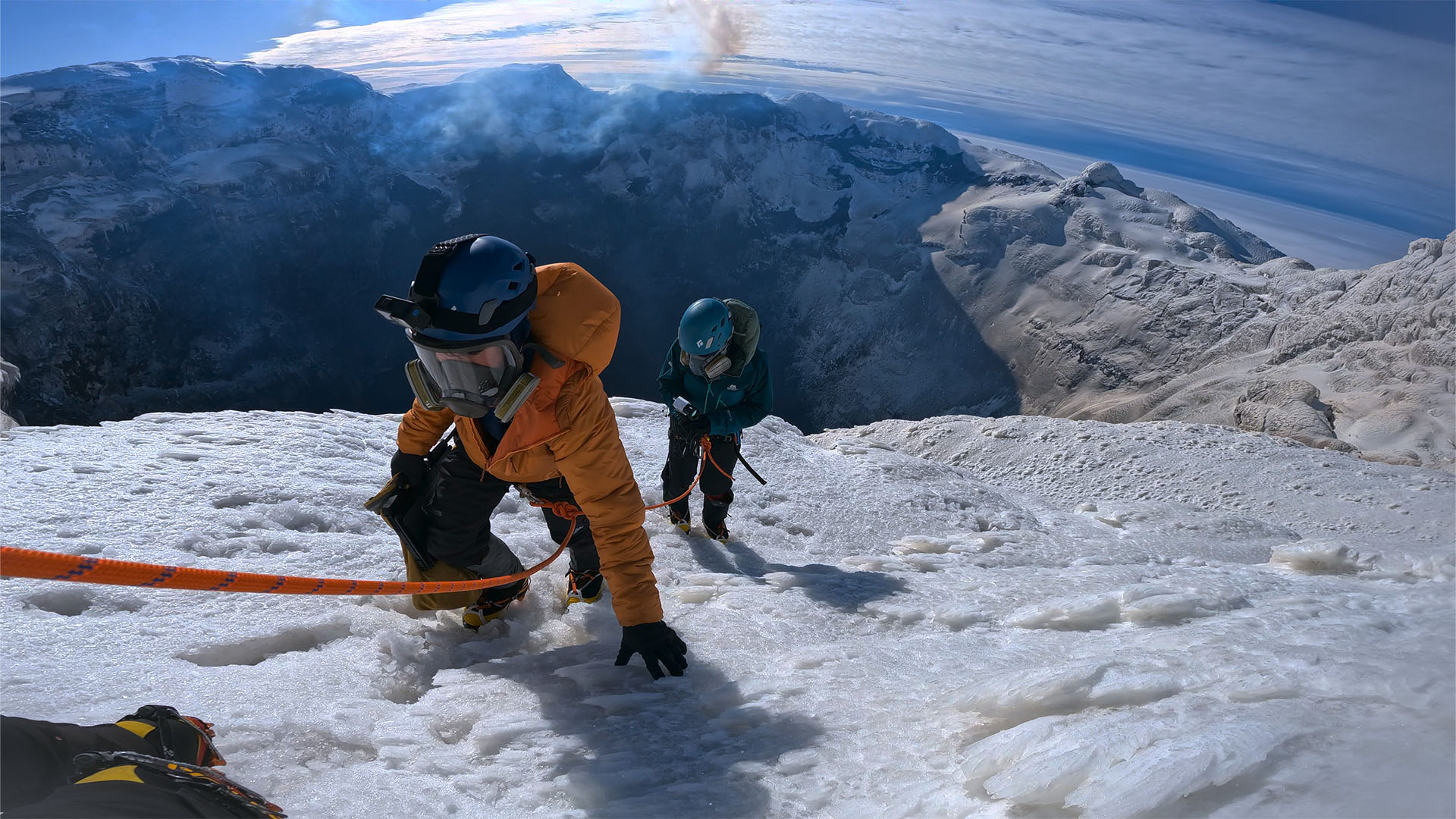 At the summit, two members of the expedition team belay as close to the crater's edge as... [Photo of the day - October 2023]