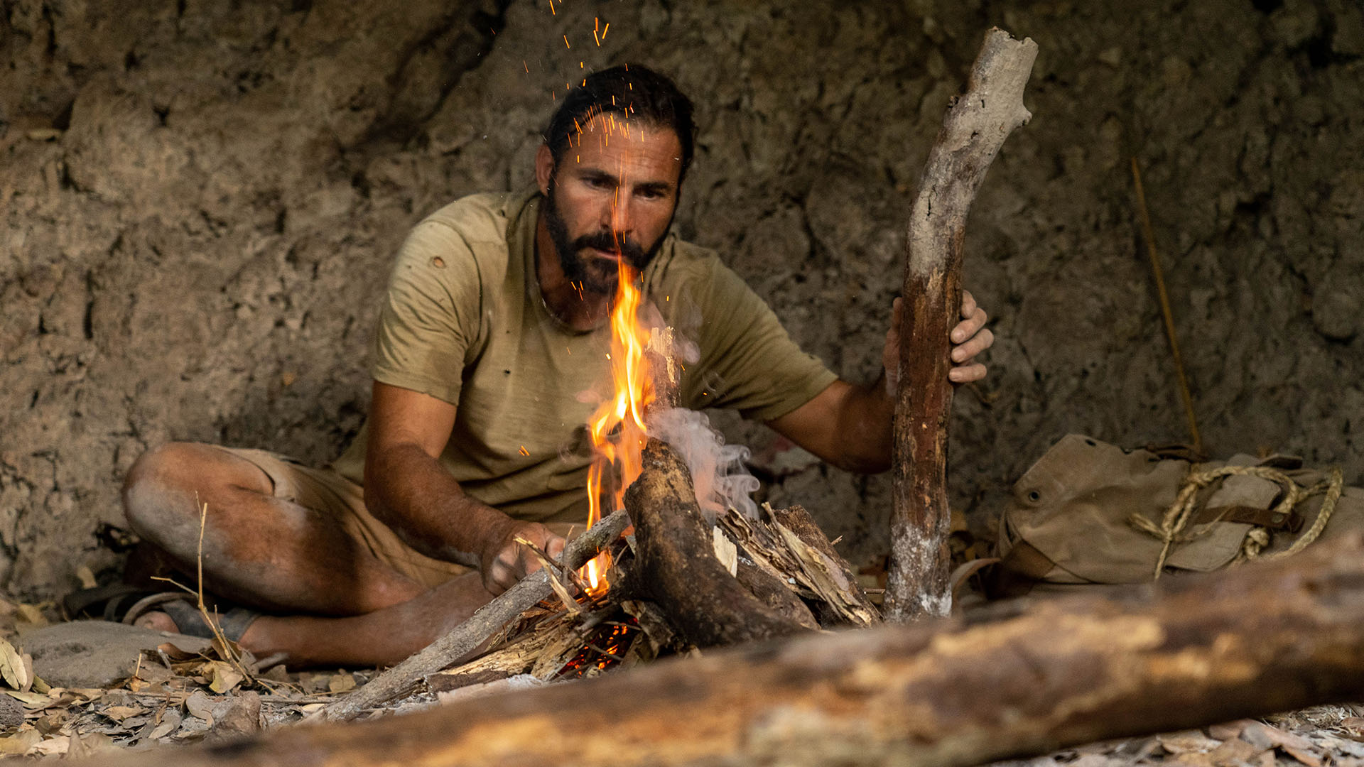 Hazen Audel sits in a cave building a fire. This is from Primal Survivor: Extreme African Safari. [Photo of the day - November 2023]