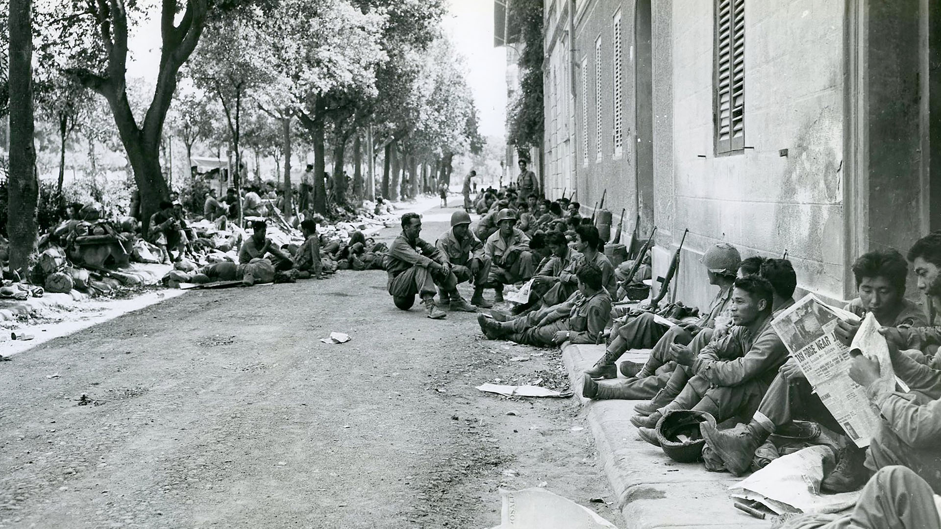 American soldiers of Japanese ancestry from the 100th Infantry Battalion rest on the streets of... [Photo of the day - December 2023]