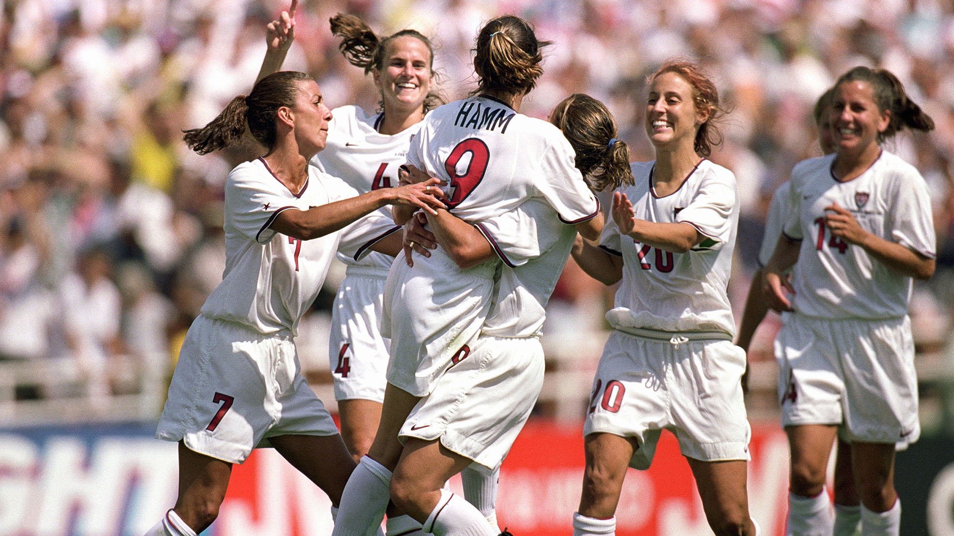 Mia Hamm #9 of Team USA is embraced by Shannon MacMillan #8 as teammates Joy Fawcett #14, Kate... [Photo of the day - January 2024]
