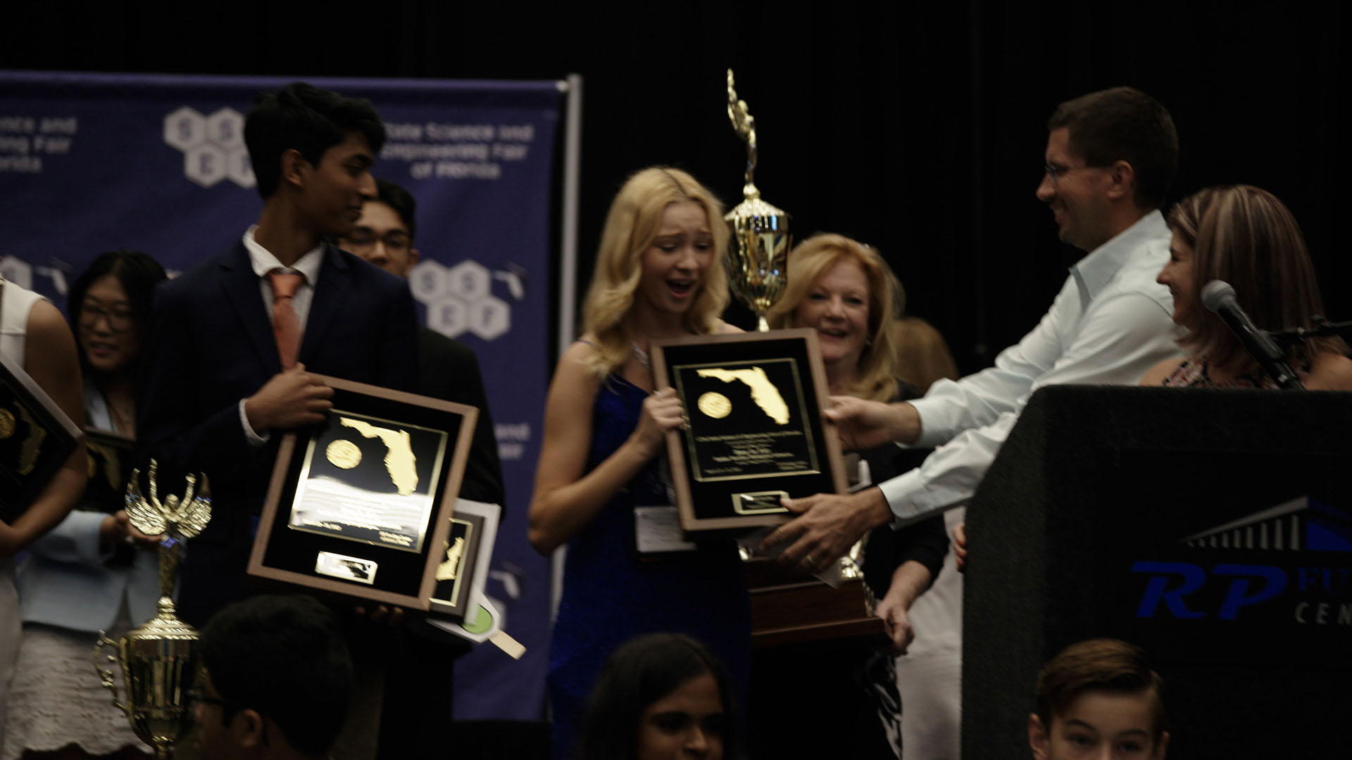 Erin Gaydar receives a plaque at the Science and Engineering Fair of Florida in Lakeland, Fla. ... [Photo of the day - January 2024]
