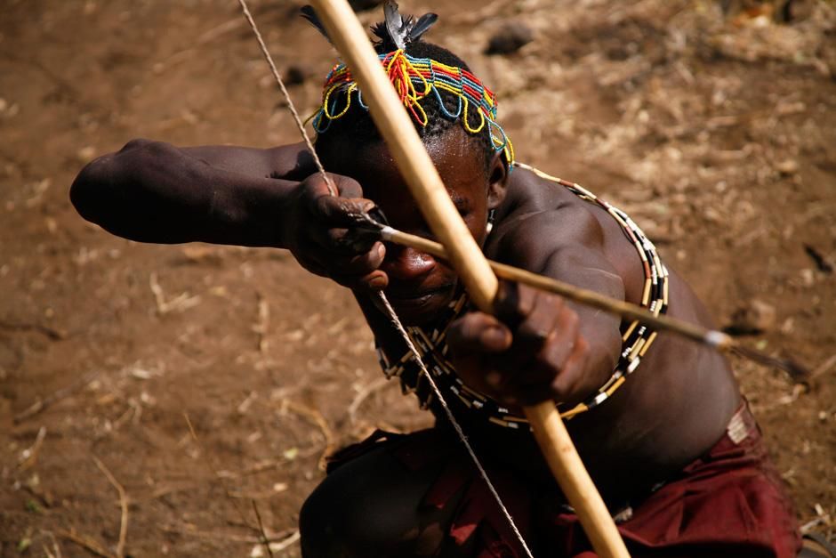 LAKE EYASI, TANZANIA: Hadzabe man with bow and arrow.  The Hadzabe, who live about 15-hundred... [Photo of the day - October 2012]