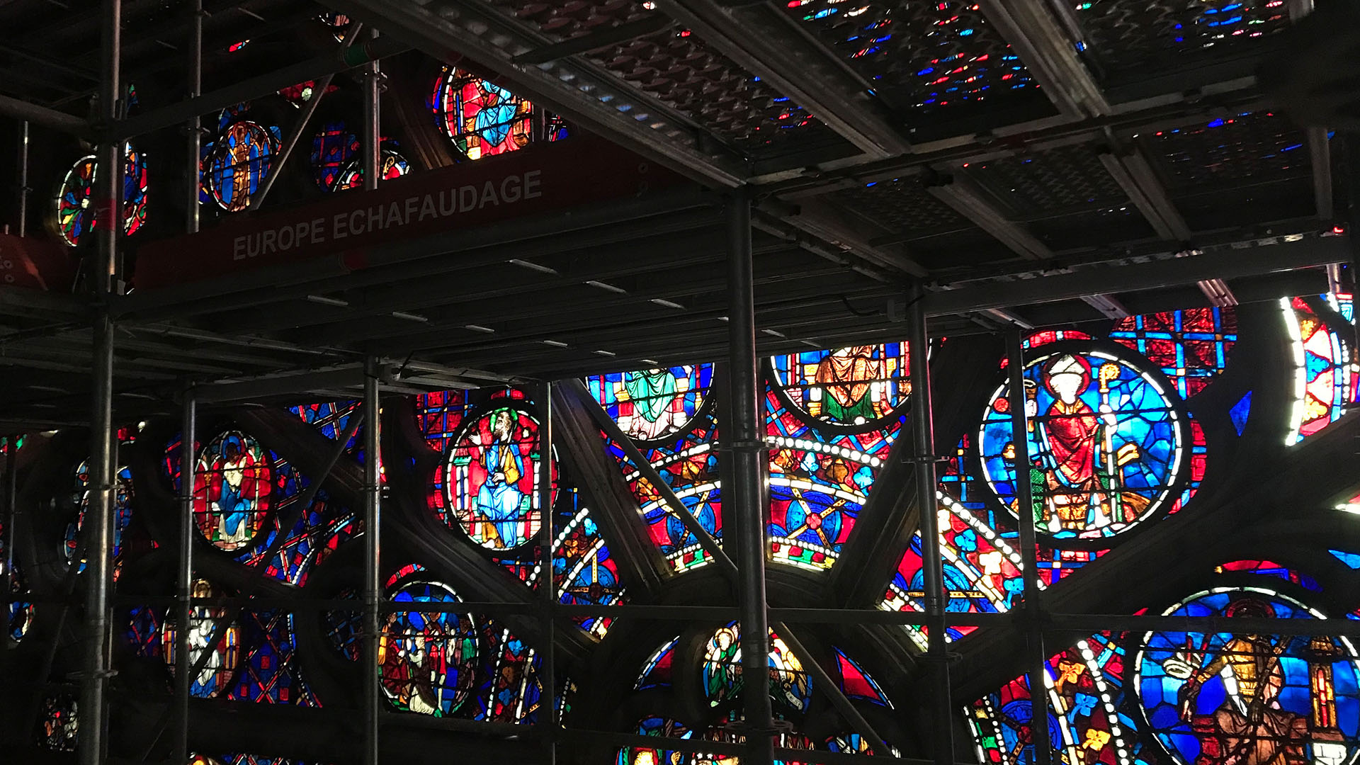A section of the south rose window is pictured behind scaffolding during Notre Dame's... [Photo of the day - April 2024]
