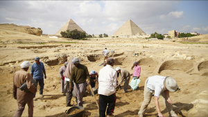 A group of workers excavate the... [Photo of the day -  7 يونيو 2024]