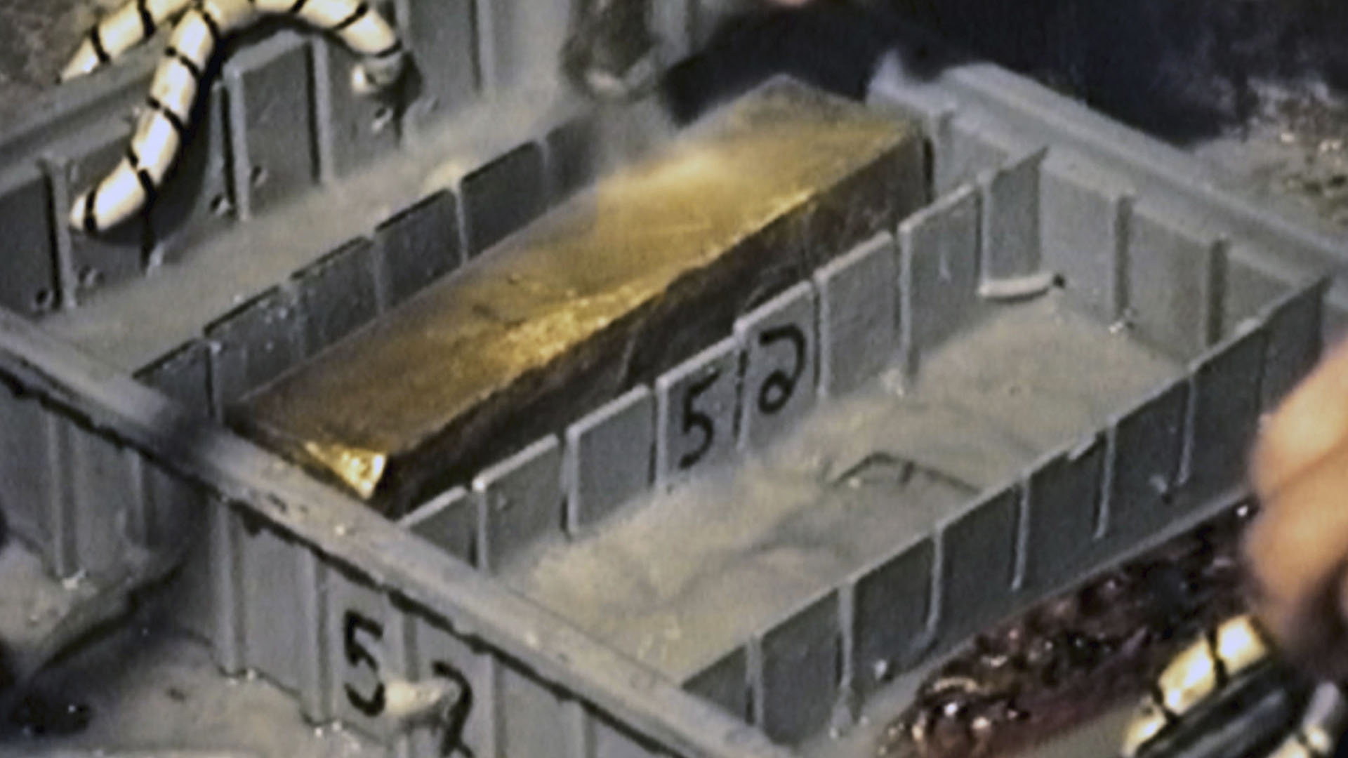 Gold bars in plastic retrieval boxes are placed on deck after being found and brought up from... [Photo of the day - August 2024]