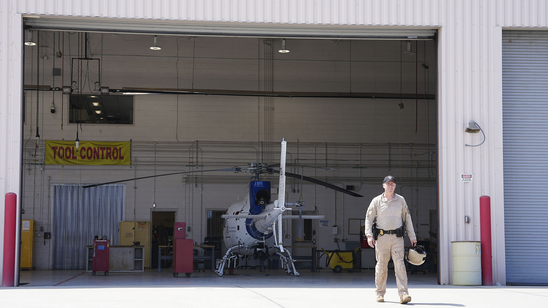 Air Enforcement Agent Murray walks across a tarmac to a CBP air vehicle in San Diego, Calif.... [Photo of the day - September 2024]