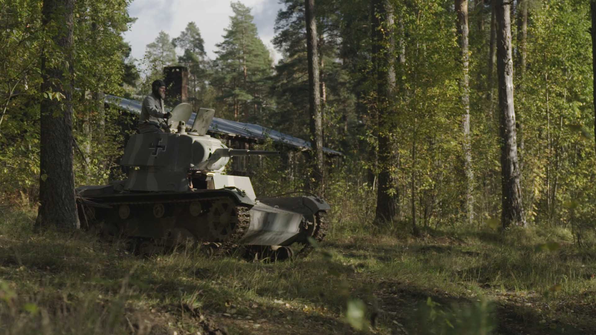 A man on a tank in the woods. This is from Defending Europe. [Photo of the day - October 2024]