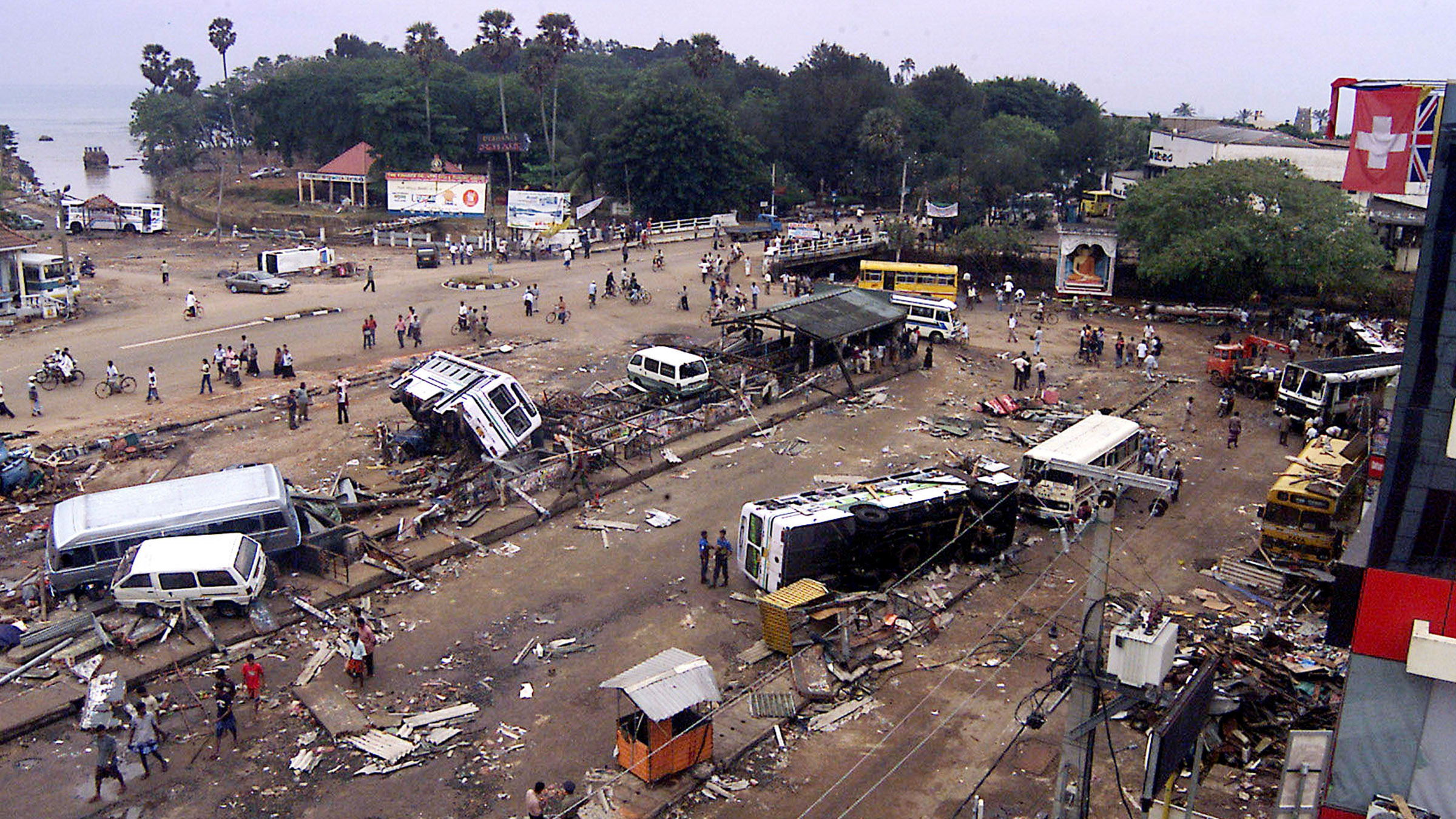 Overturned buses and debris are scattered at the Galle bus station in Galle, Sri Lanka. When a... [Photo of the day - December 2024]