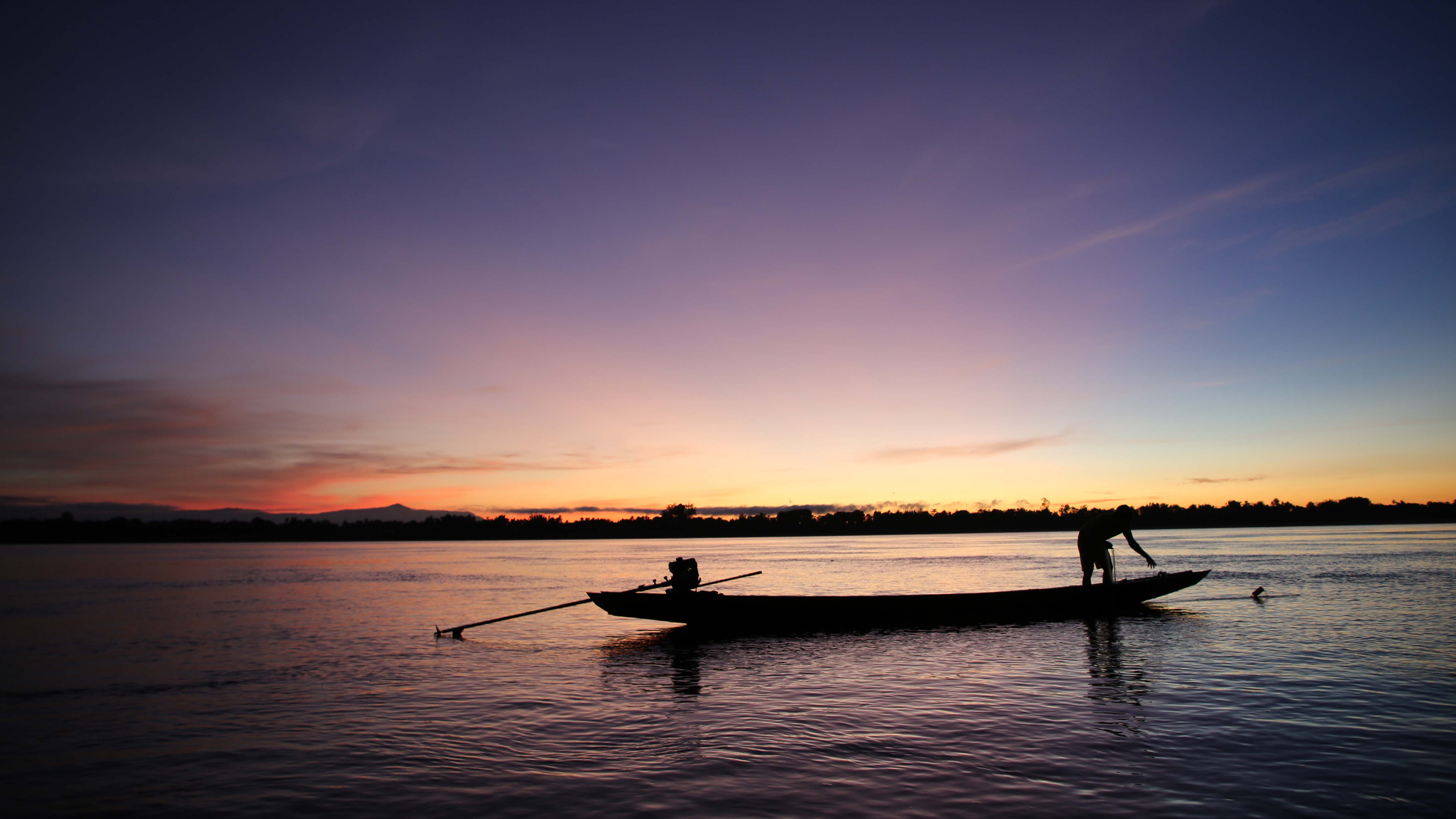 Boat overlooking a sunrise on the Mekong River. This is from Lost Treasures of Angkor Wat. [Photo of the day - January 2025]