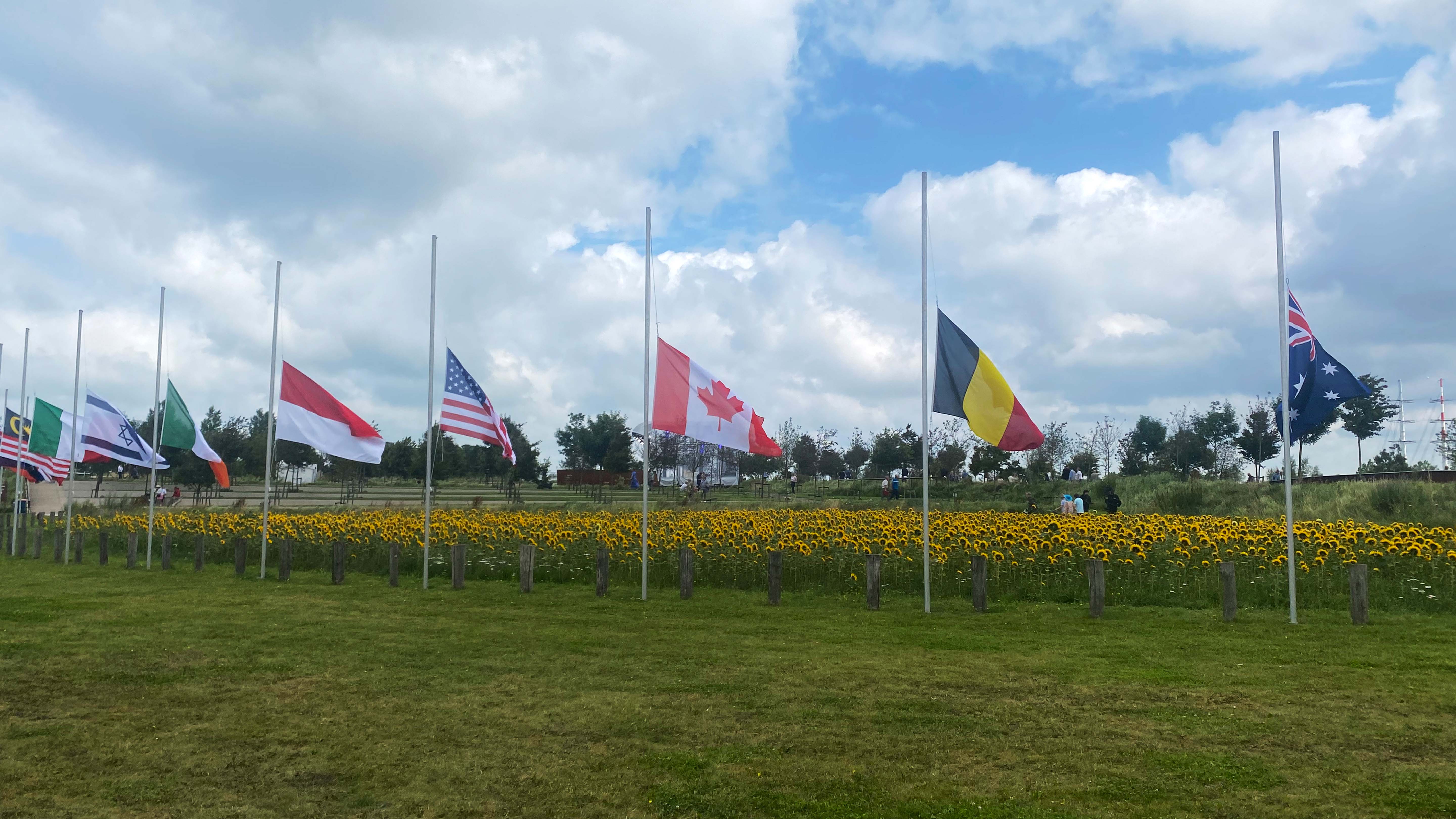 Flags wave during a commemoration ceremony for the MH17 victims in Eindhoven, Netherlands. This... [Photo of the day - February 2025]