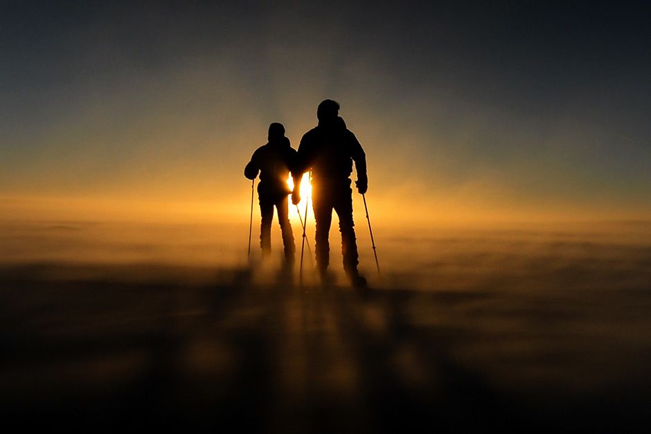 Queen Maud Land, Antarctica: Two members of the team ski through the Antarctica dusk. In the... [Photo of the day - October 2013]