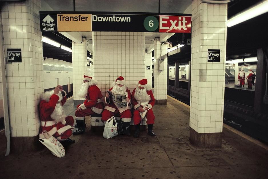 A team of department store Santas wait for the New York City Subway, New York City. [Photo of the day - December 2011]
