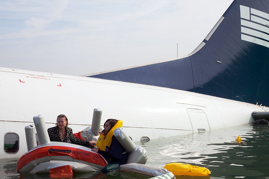 REENACTMENT: Passengers try to stay afloat after the plane crashes in the water. This image is... [Photo of the day - January 2014]