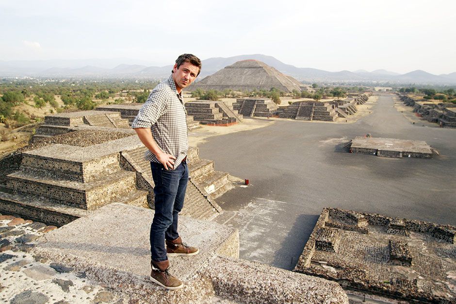 Mexico City, Mexico: Conor Woodman at the top of the Moon Pyramid investigating the artefact... [Photo of the day - January 2014]