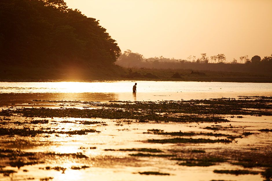 Chitwan National Park, Nepal: A Nepali man fishes in the Rapti River on the edge of Chitwan... [Photo of the day - January 2014]