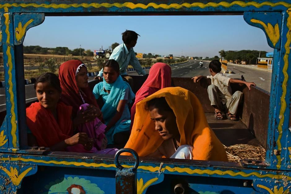 Workers travel the Golden Quarilateral Highway in Palu, Rajasthan. [Photo of the day - February 2011]