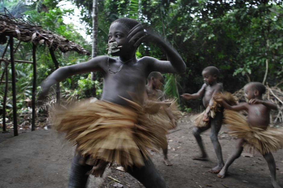 Mbuti boys wear grass skirts during their cucrcumcision ceremony. [Photo of the day - March 2011]