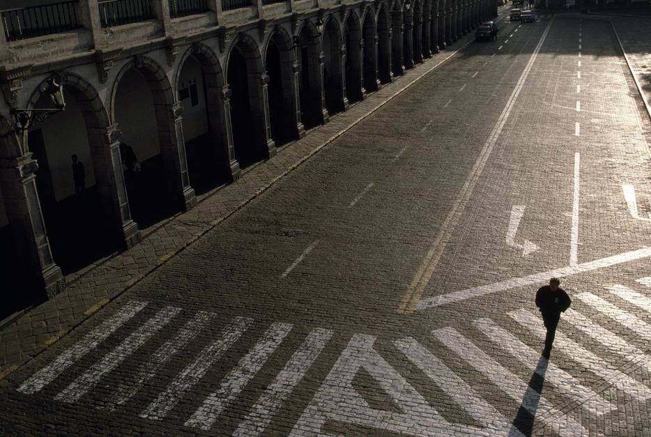 A man crosses the cobblestones of the Plaza de Armas in Arequipa. [Photo of the day - April 2011]