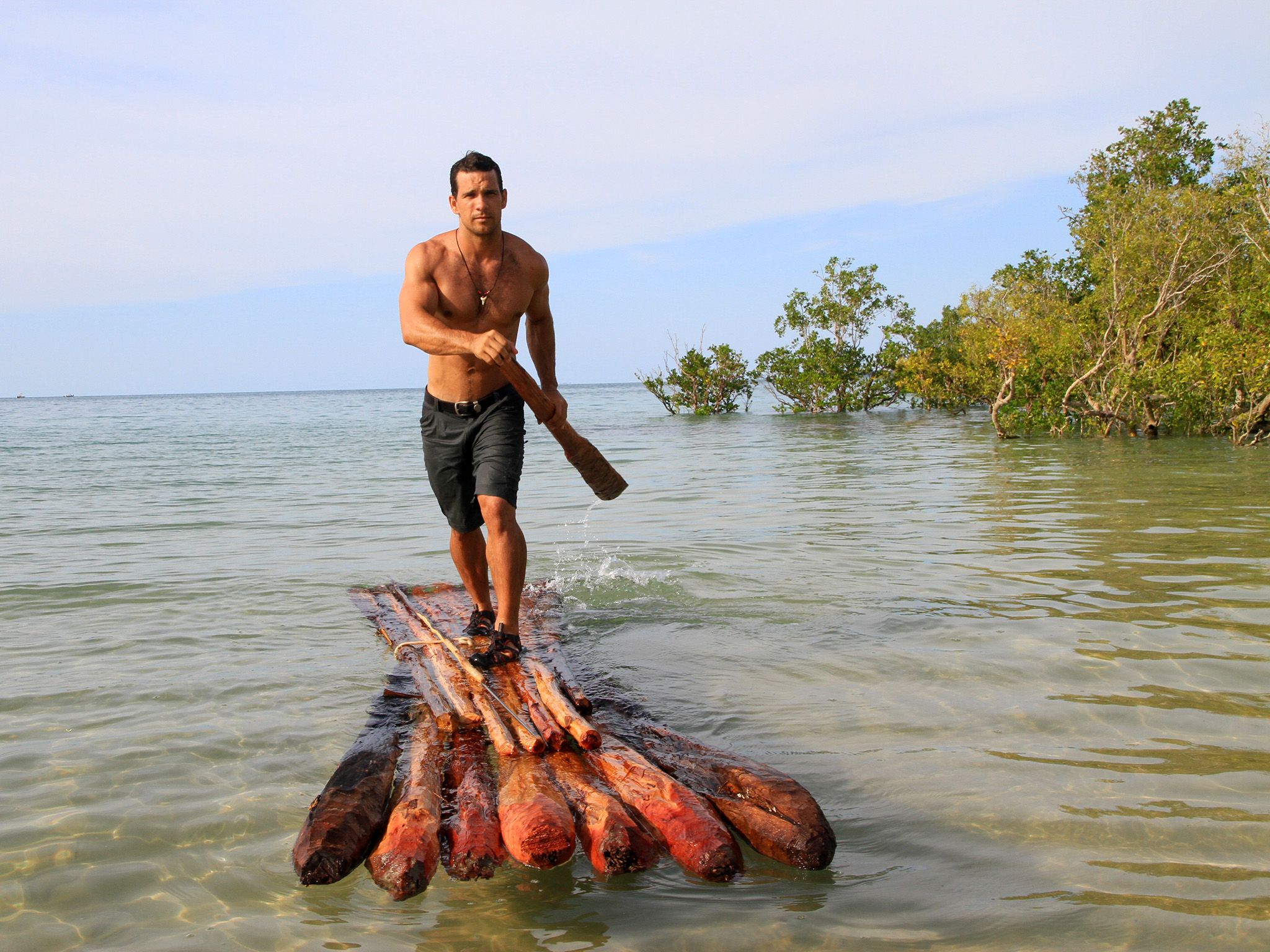 Sunday Island:  Phil Breslin standing on a raft he made.  This image is from Wild Survivor. [Photo of the day - March 2015]