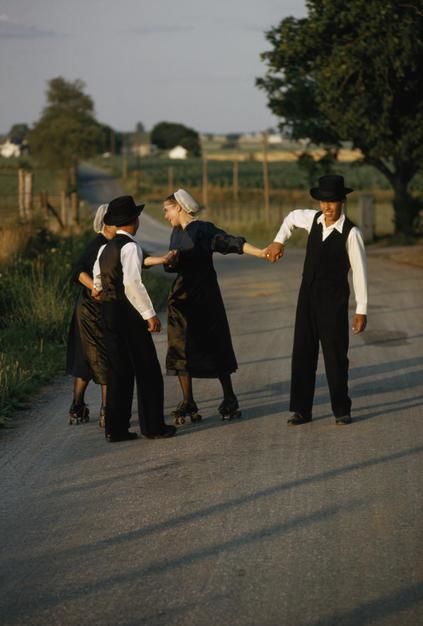 Amish lads pull roller skating friends on a country road in Lancaster Country, Pennsylvania. [Photo of the day - April 2011]