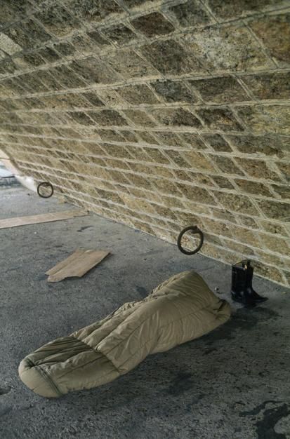 A poor traveller sleeps in a sleeping ag underneath a Paris bridge, Ile de la Cite. [Photo of the day - April 2011]