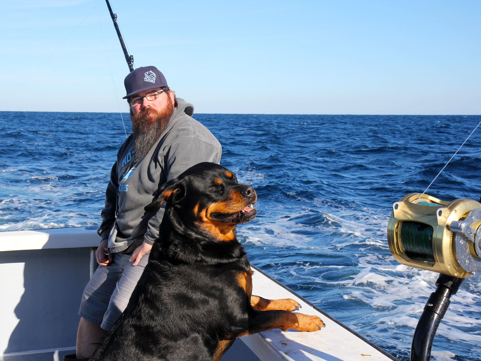 The Outer Banks, NC:  Deckhand Mike Ott and Mascot Reba Ott enjoy a relaxing moment before chaos... [Photo of the day - September 2015]