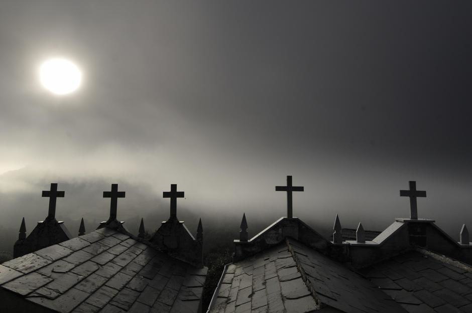 Sun shining through fog on Mausoleums in Galicia. [Photo of the day - June 2011]