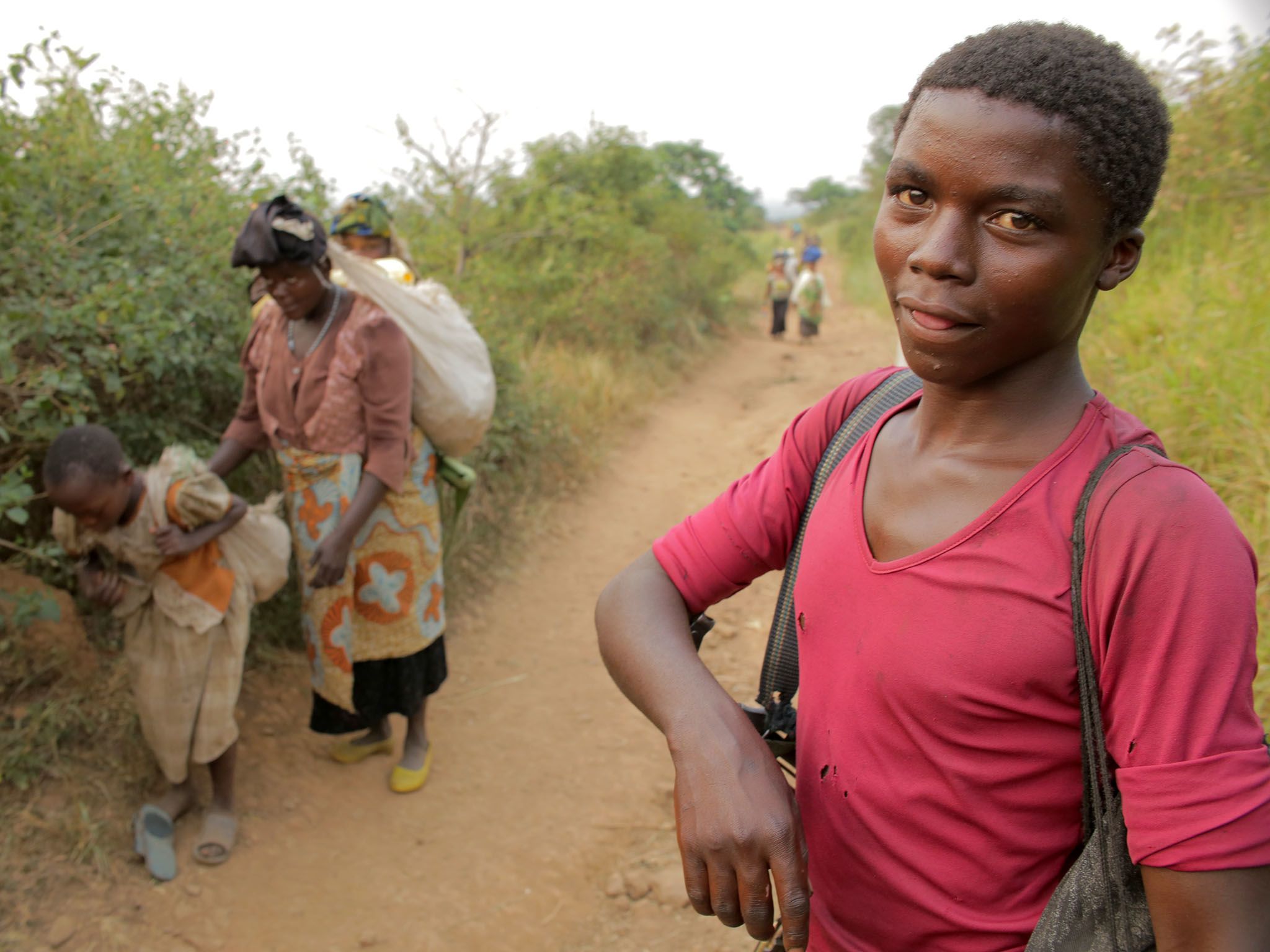 Kafunzo, Democratic Republic Of The Congo: A young Mai Mai soldier hikes to the militia's... [Photo of the day - July 2016]