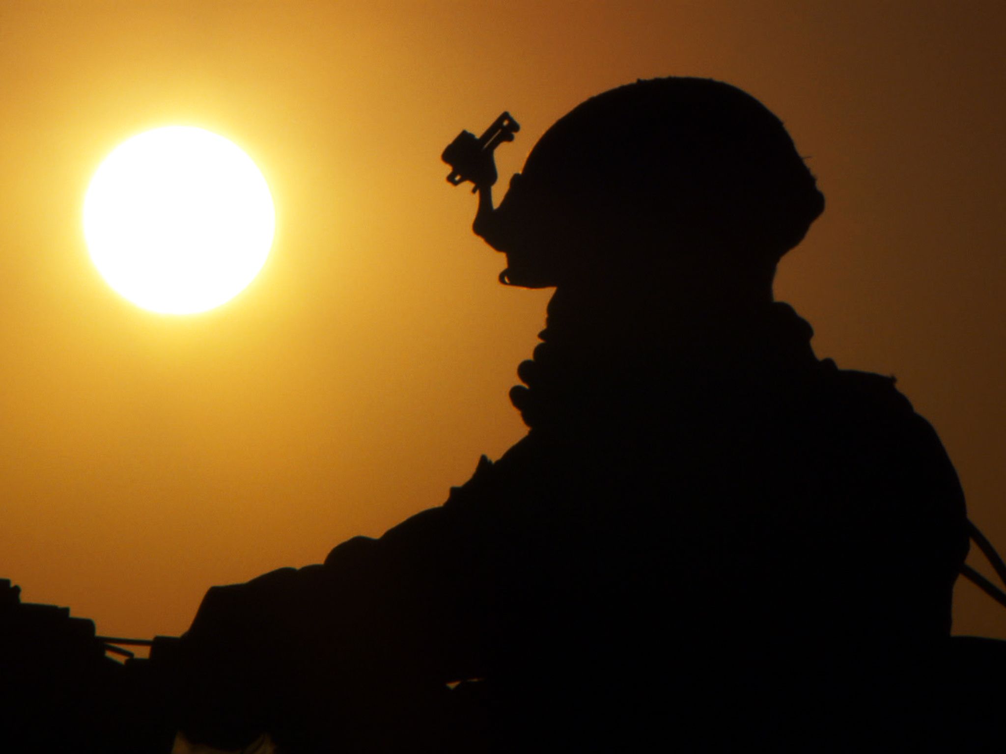 Helmand Province, Afghanistan: A silhouette of a Marine gunner and the sun in Afghanistan. This... [Photo of the day - November 2016]