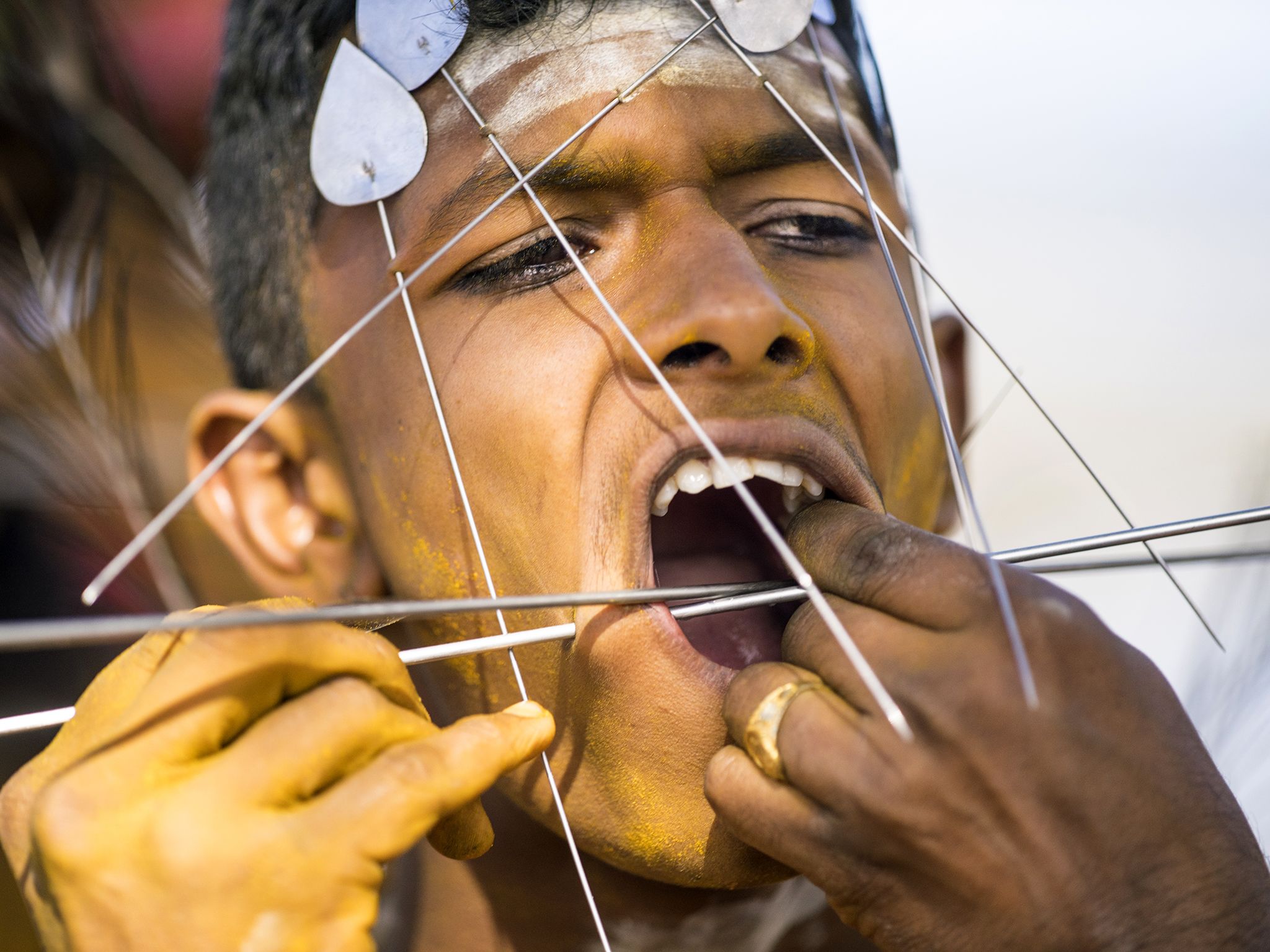 Suva, Fiji: Young devotee is pierced by priests as a sign of devotion, before making the walk... [Photo of the day - July 2017]