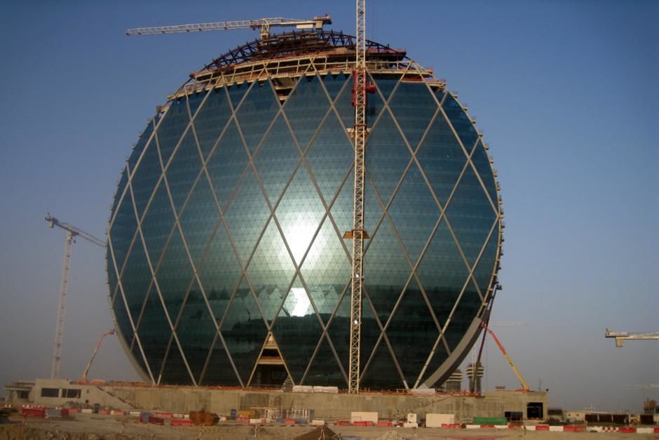 Abu Dhabi, United Arab Emirates: The Aldar headquarters building under construction with cranes... [Photo of the day - March 2012]
