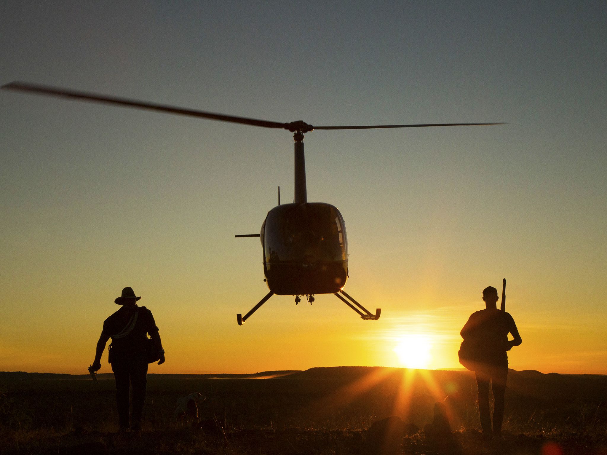 Northern Territory, Australia:  (L to R) Chris Wilson and Jono Brown walk near helicopter... [Photo of the day - January 2018]