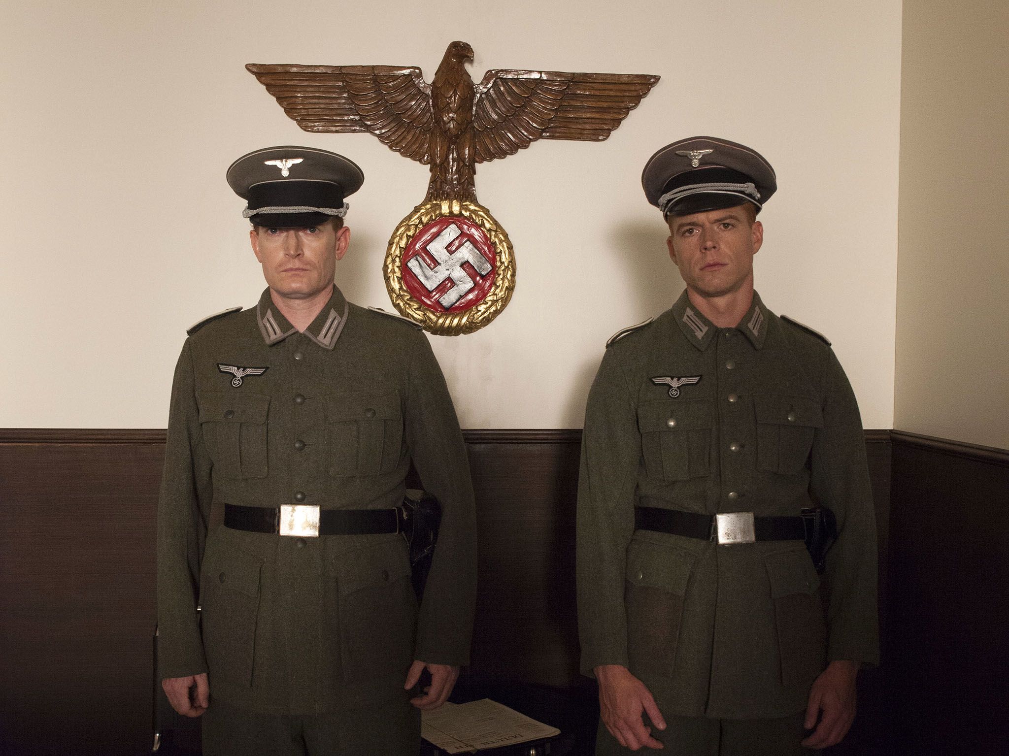 Reenactment: German guards stand under Nazi logo in boarding terminal for Hindenburg.  This... [Photo of the day - June 2018]