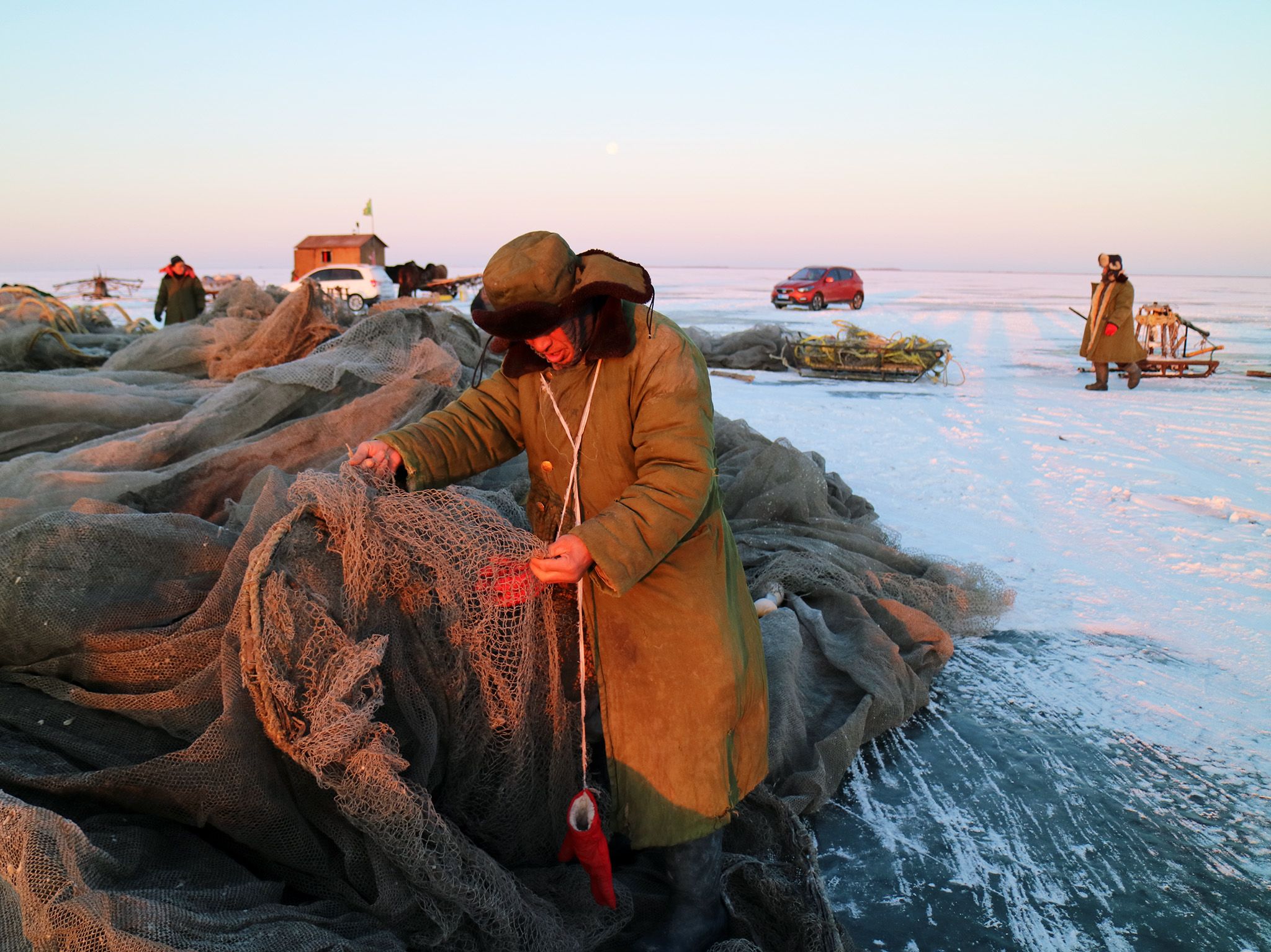 Jilin Province, China: Mongolian fisherman checking his net before a day of fishing on the ice. ... [Photo of the day - August 2018]