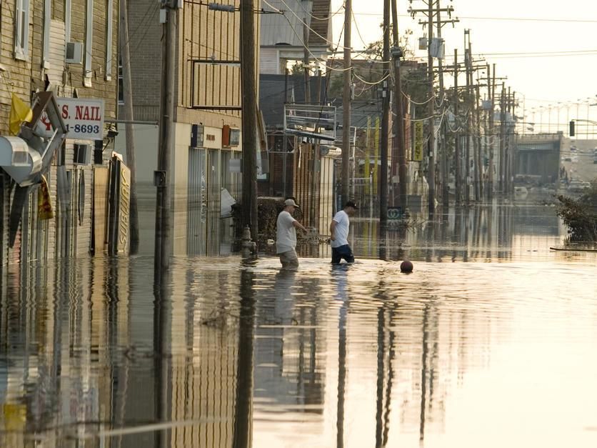 People walking the flooded streets of New Orleans after Hurricane Katrina in 2005, New Orleans. USA. [Photo of the day - August 2011]