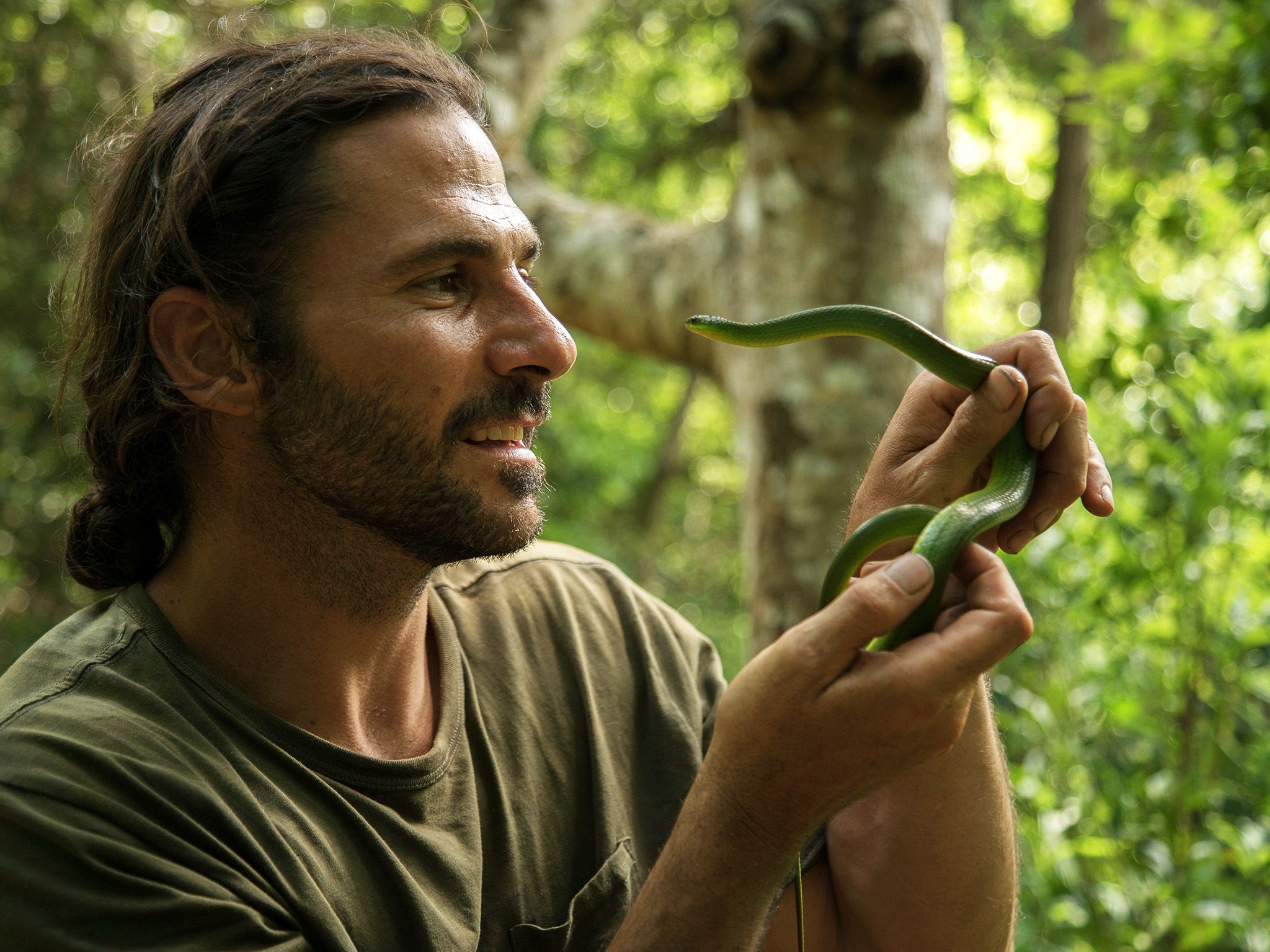 Biasha, China:  Hazen holding a snake.  This image is from Primal Survivor China. [Photo of the day - January 2019]