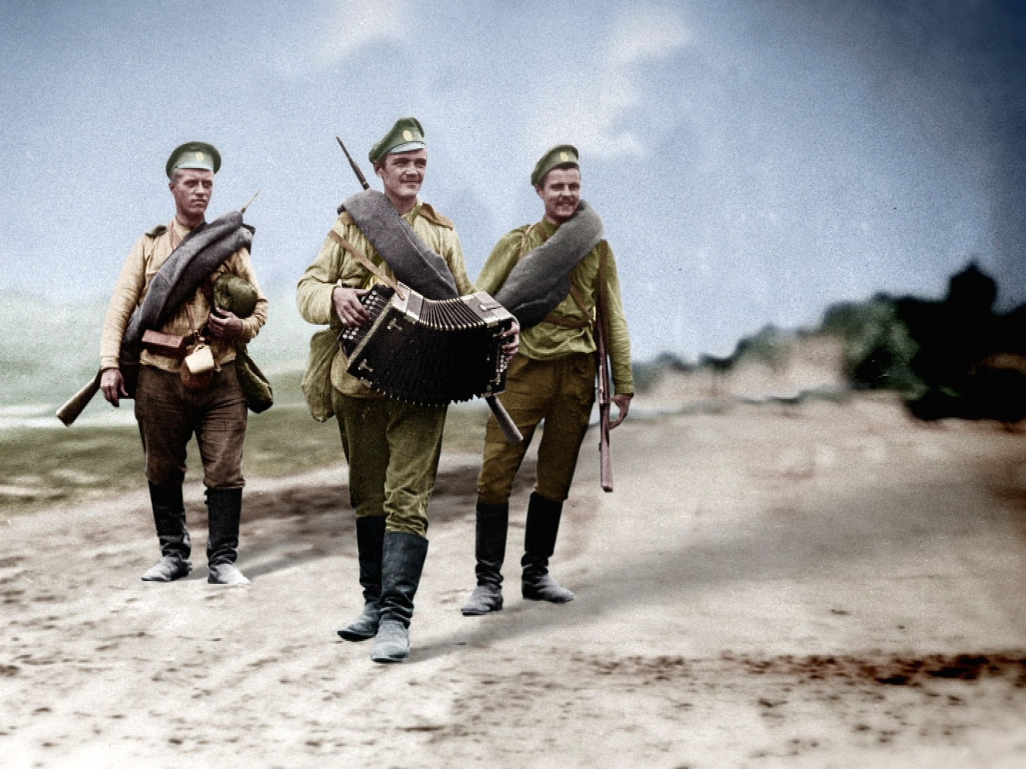 Soldiers follow as another plays accordion.  This image is from 1917: One Year, Two Revolutions. [Photo of the day - February 2019]