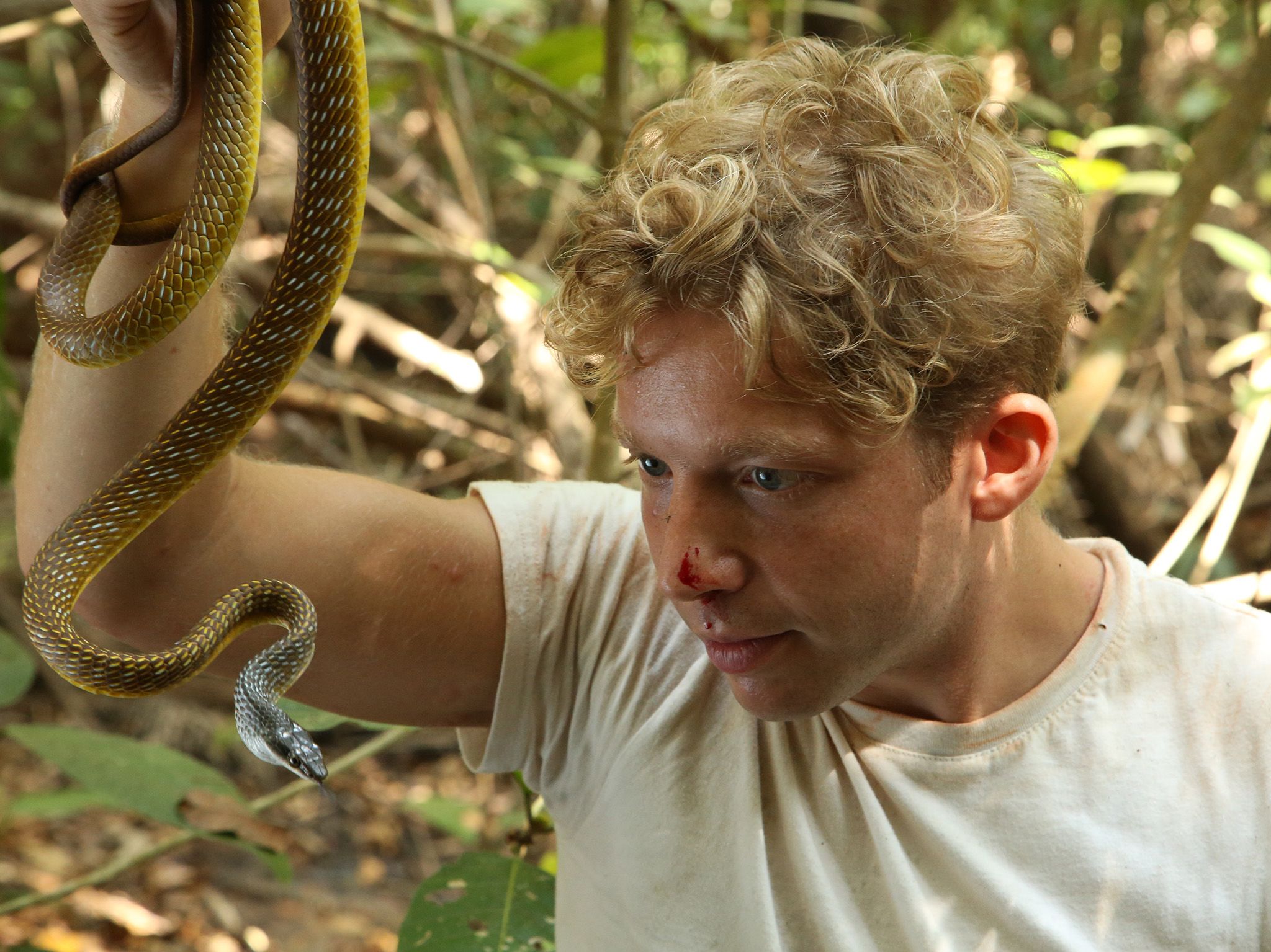 Point Stuart, Northern Territory, Australia:  Jack Randall poses with the angry snake that bit... [Photo of the day - August 2019]